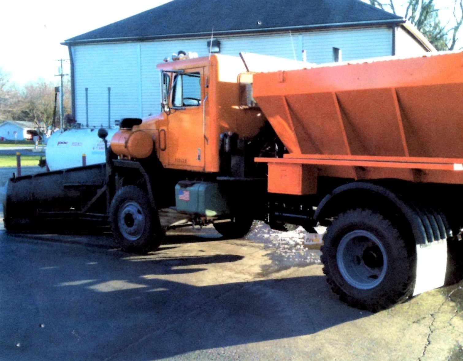 Plato Township snowplow and salt truck parked outside the Highway Department